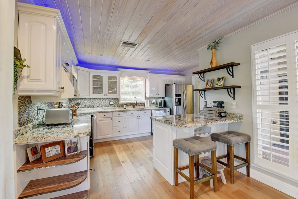 Clean and modern gourmet kitchen with all new stainless steel appliances. 