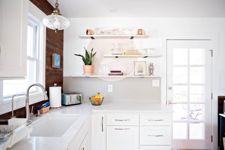 Beautiful light filled kitchen with new cabinets and antique marble shelves.