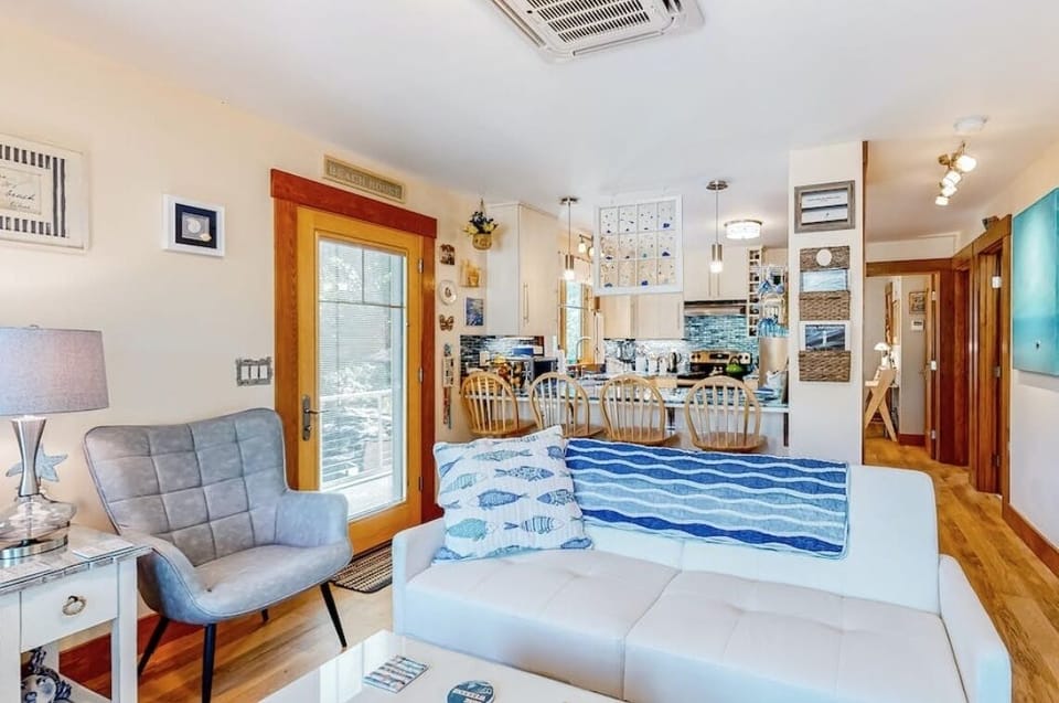 Looking towards the kitchen and down the hall towards the bedrooms