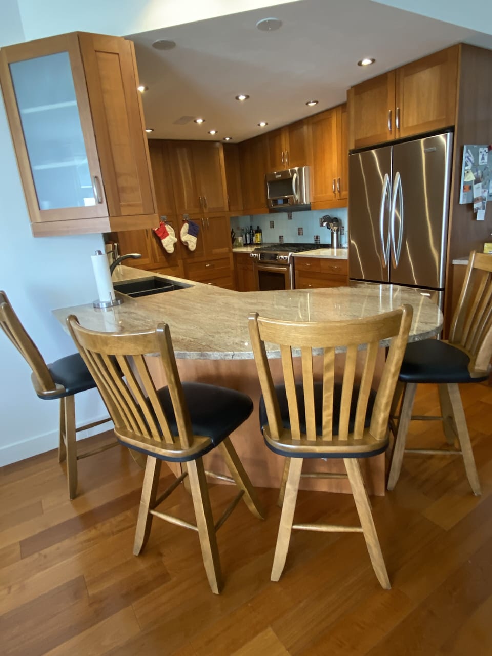 Cabinet on left opens for easy access to coffee cups.  Counter seats 4.