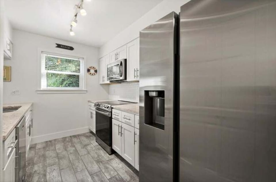 Beautiful stainless steel appliances in the light and bright kitchen.