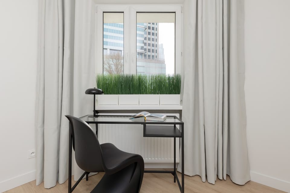 Enjoy the simplicity and comfort of the bedroom's modern design. 