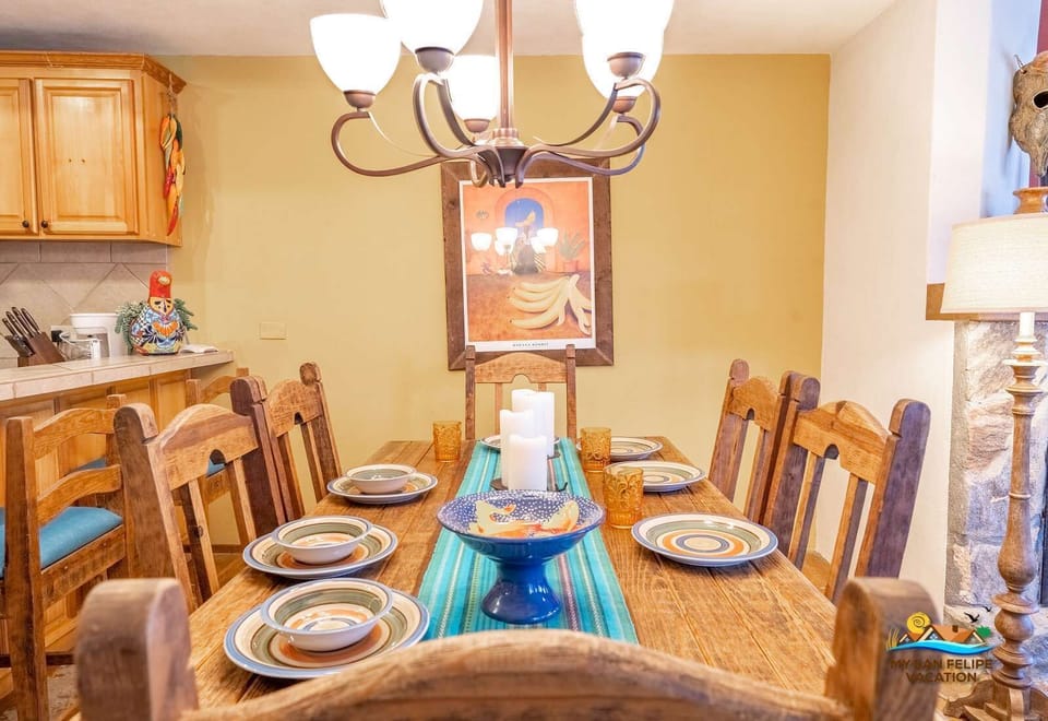 Conveniently located next to the kitchen, the dining table at Casa Sonora offers ample seating for enjoying meals with friends and family