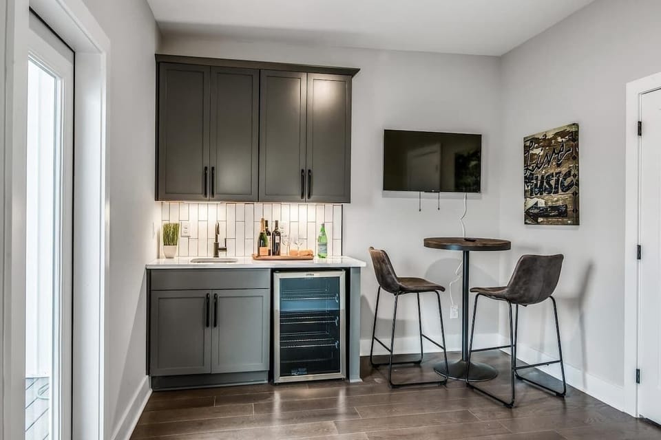 Enjoy drinks at the wet bar leading to the rooftop.