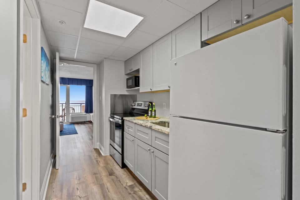 Fully-equipped kitchen with stainless steel appliances, perfect for cooking up a storm. 
