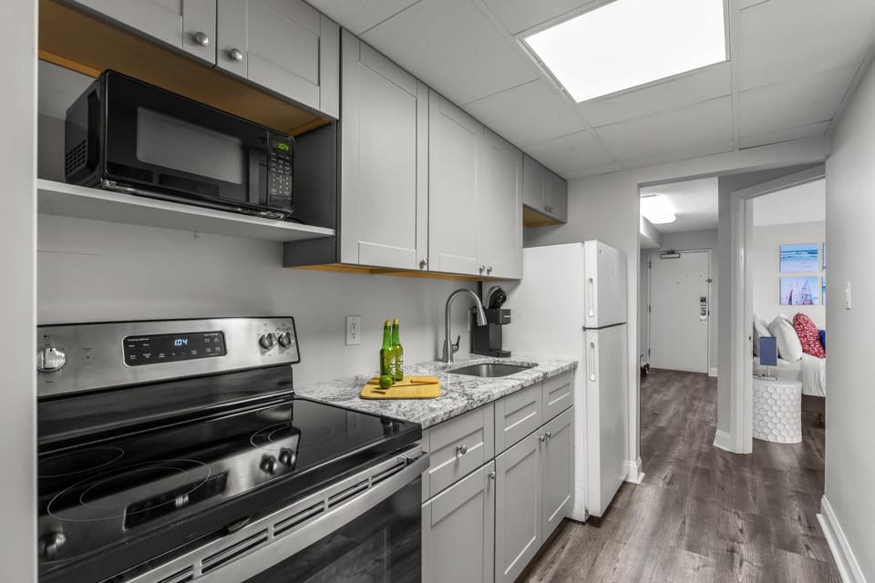Fully-equipped kitchen with stainless steel appliances, perfect for cooking up a storm. 
