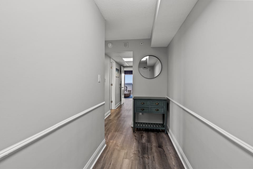 Spacious entryway with plenty of storage space and a view of the ocean. 
