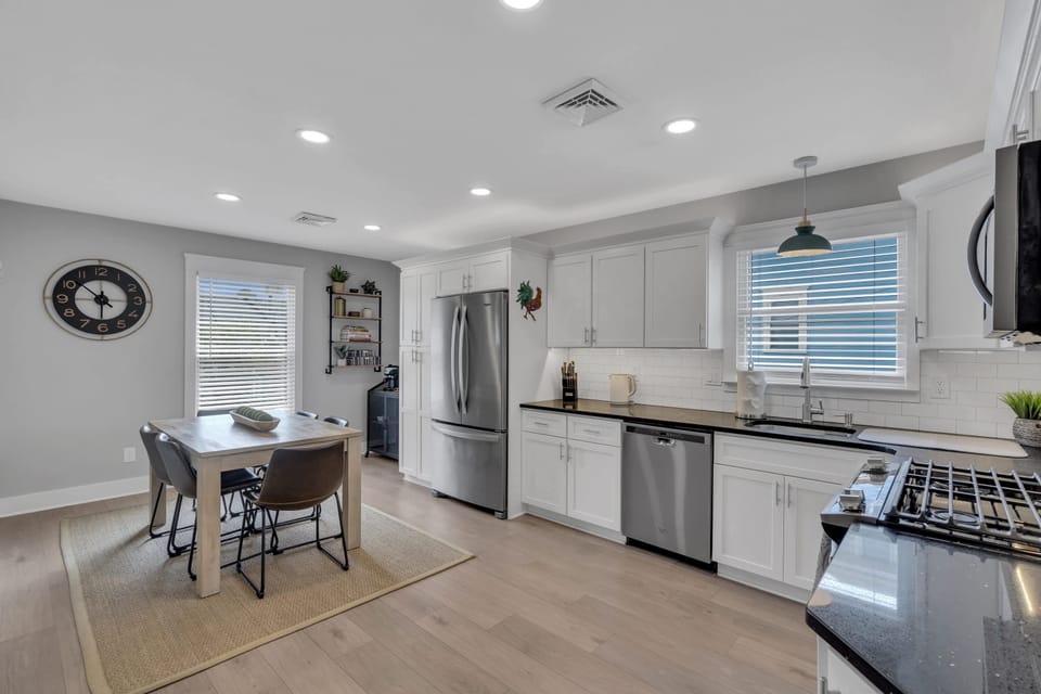 Sun filled kitchen with all stainless appliances