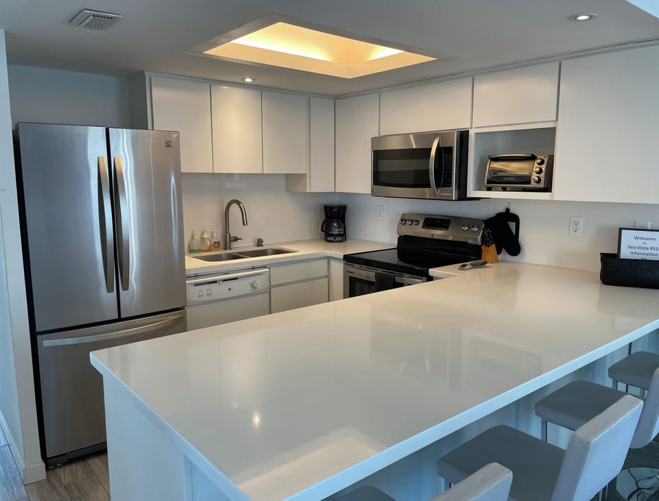 Fully Appointed Kitchen with a quartz countertop.