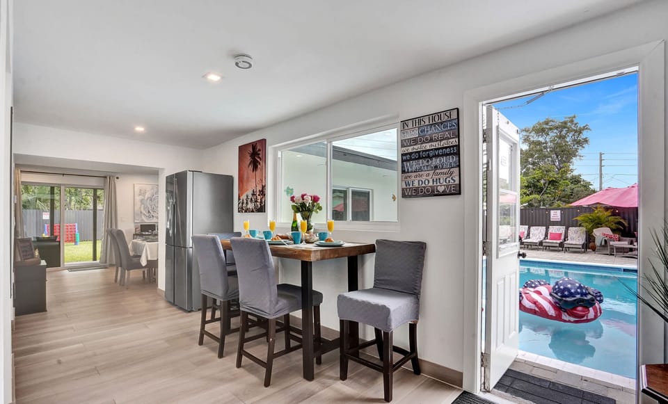 Start your day in our cozy breakfast nook! Enjoy your morning coffee or a quick meal at the high-top table while taking in the beautiful views of the private pool just steps away.