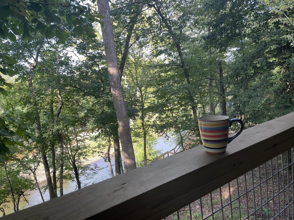 Enjoying a cup of coffee, while watching the river before anyone else is up