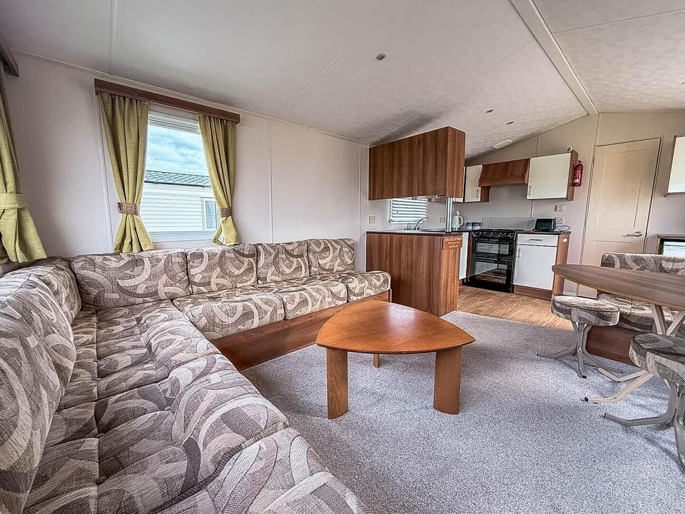 Prepare your favourite holiday meals while still being part of the UK family holiday fun in this convenient open plan caravan kitchen.