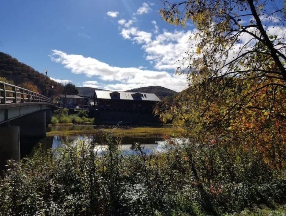 Feed the ducks on the river from the deck of Greenbrier Grill in town