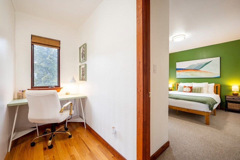 Need to get some work done during your stay at our spacious lodge in Colorado? Our second-floor workspace offers a peaceful and productive environment with a stunning view of the surrounding green forest. 