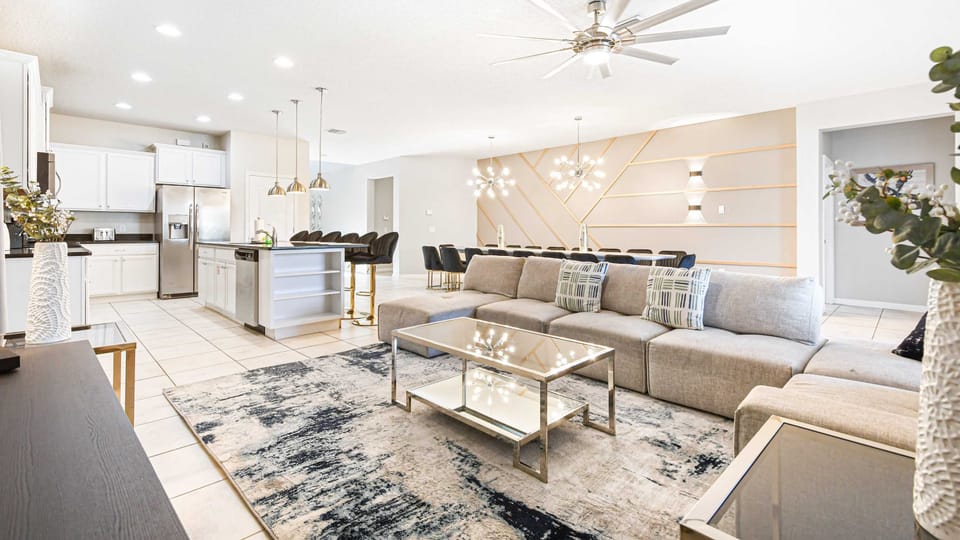 Stylish open living space with modern lighting and a spacious dining area.