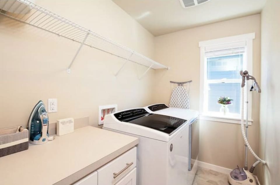 The Laundry room has washer, dryer and steamer