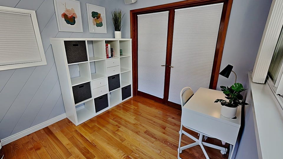 Great dual office space / extra bedroom with twin sized day bed and lots of storage. Beautiful wide glass windows with view.