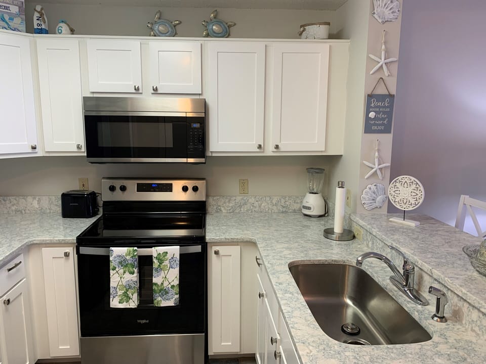 Kitchen with new appliances and granite counter tops