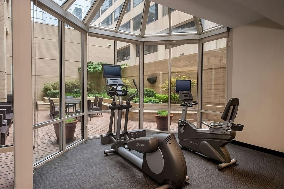 Refresh your routine with sunlit cardio beside the courtyard
