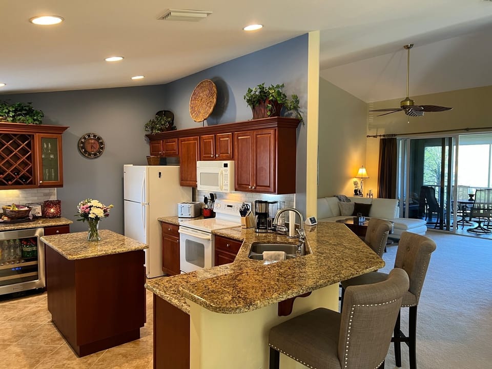 Updated Kitchen from Cornerstone w/wine fridge, wine rack & includes everything.