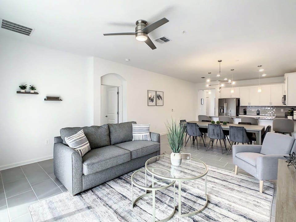 Open-concept living space with contemporary seating and dining area