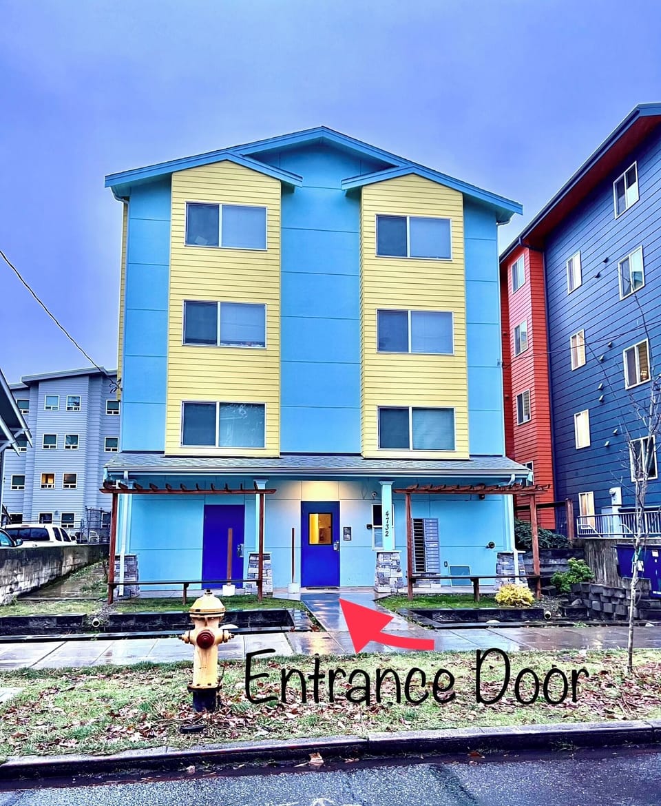 Building exterior. Blue door is the main entrance door with code