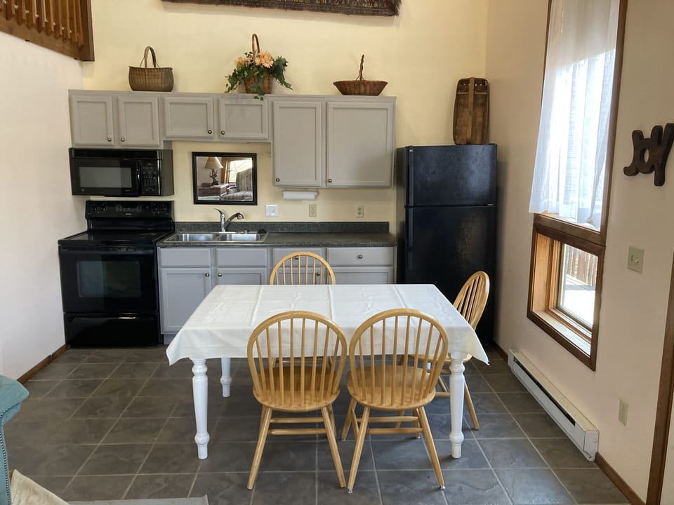 Full kitchen with seating for four