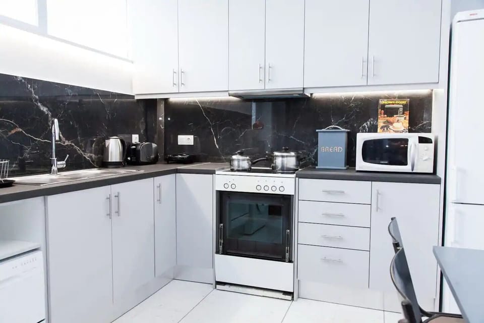 Newly rennovated luxurious  kitchen 
microwave, stainless steel pots & pans 
