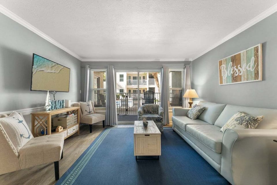 Living room with sleeper sofa & balcony access