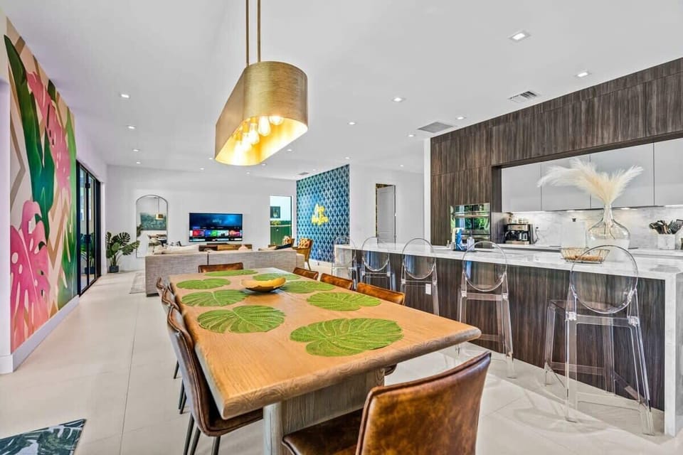 Dining room can accomodate 8 guests. Kitchen island can accommodate 5 guests.