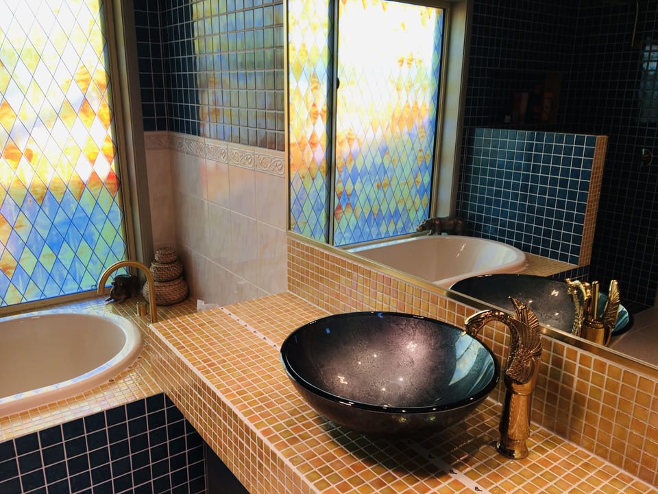 Main bathroom vanity & bath with separate toilet