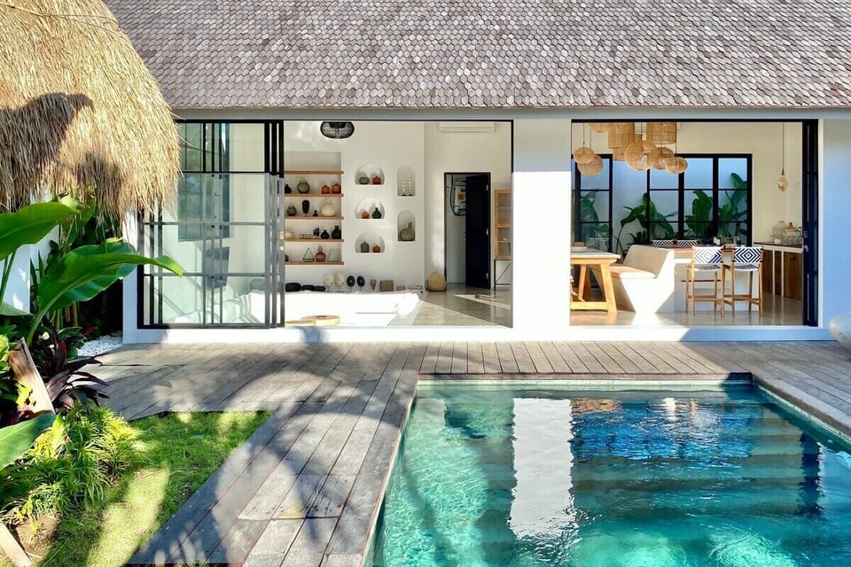 Close the modern metal sliding doors if you want Air-conditioning in the living room and kitchen during the hot Bali days and nights.