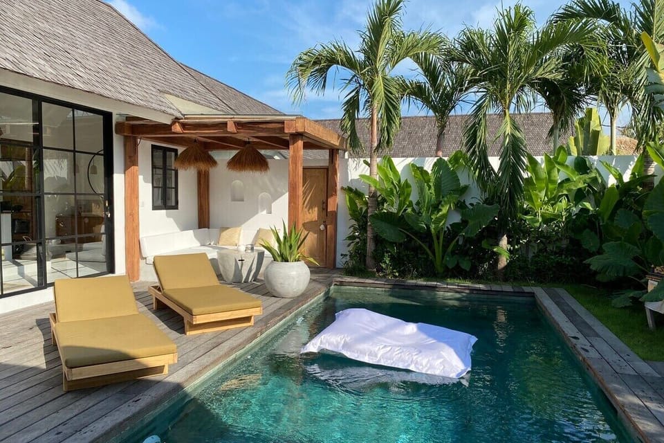 Relax on our floating bean bag in the turquoise pool and open the doors for open concept living