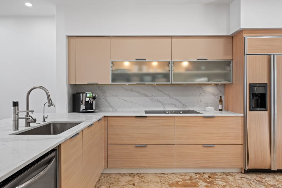 Natural wood cupboards and cabinets with white melamine counter tops Double Sink