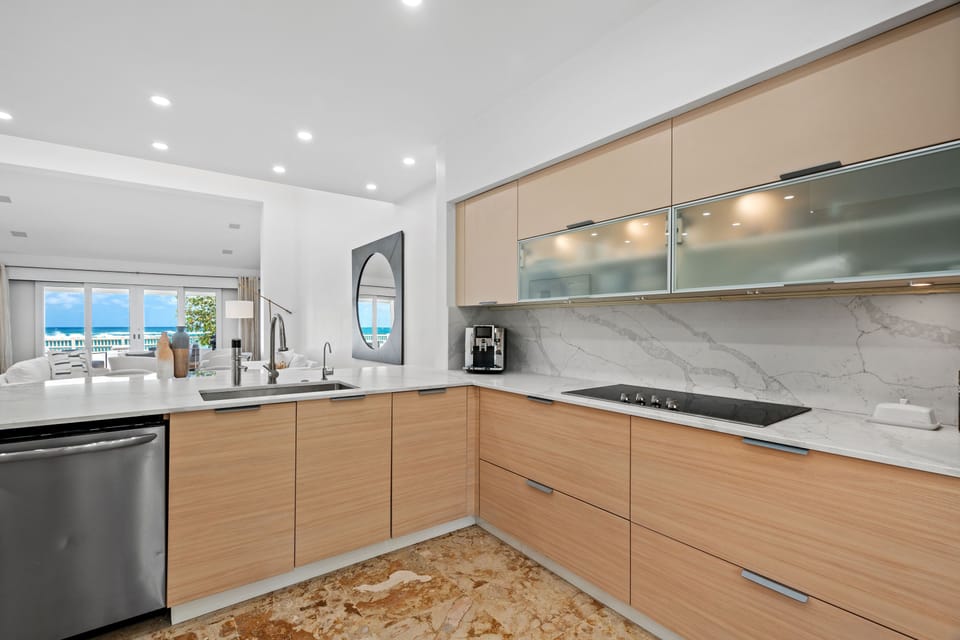 Natural wood cupboards and cabinets with white, melamine counter tops