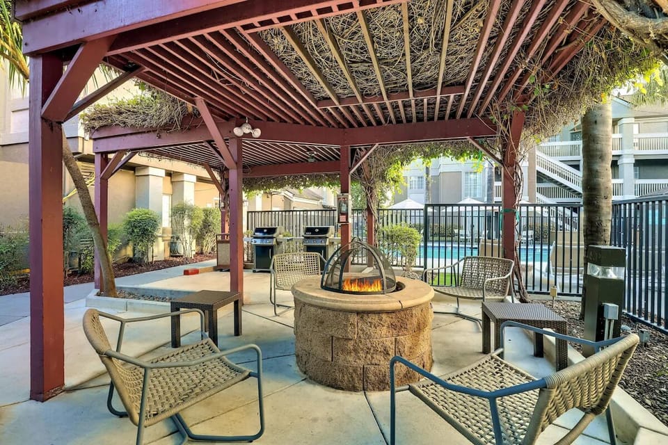 Gather by the glowing firepit and unwind under twinkle lights