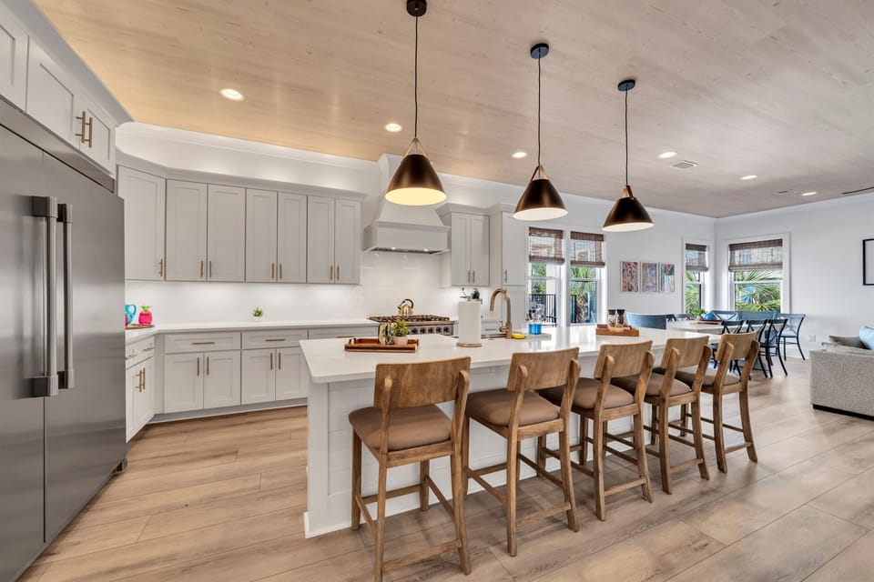 Whip up your family favorites in this sleek kitchen with high-end appliances and plenty of space to cook together.