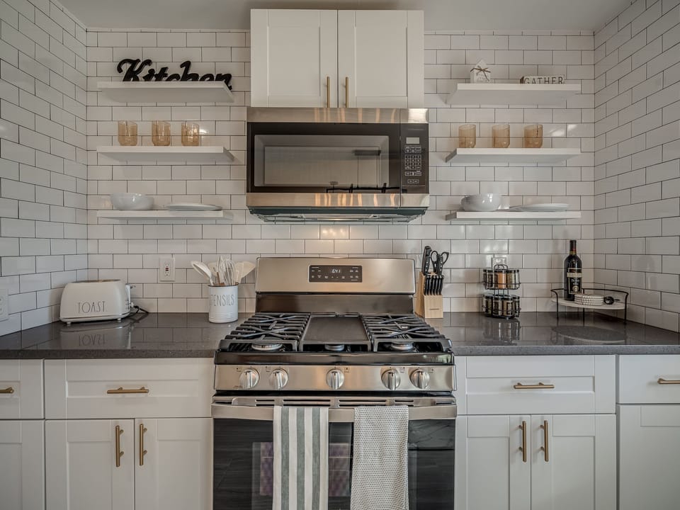 Fully-equipped kitchen. Sophisticated, yet functional, access to everything you need to cook as easily as if you were home. Updated stainless steel appliances, including a large fridge/freezer, and a 4-burner gas stove.