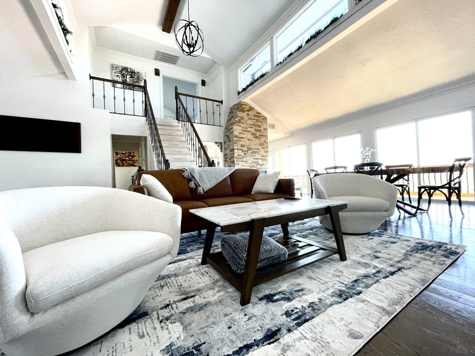 main living room & dining room/ stairs lead to master suite