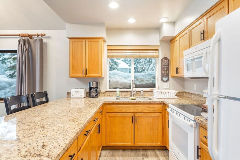Full kitchen setup with everything you need to cook a meal or brew coffee.