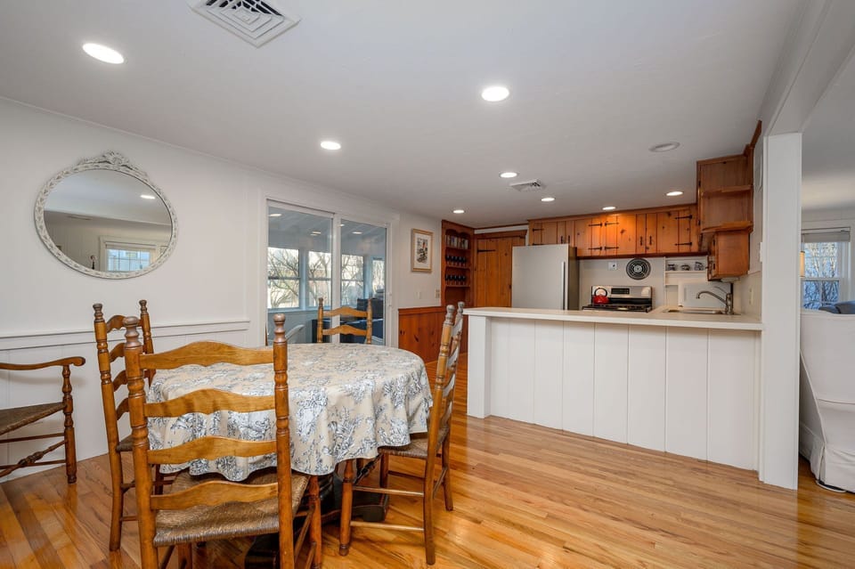 Dining area creates connection between living room and kitchen - 3 Shore Road Extension West Harwich Cape Cod - A Shore Thing - New England Vacation Rentals