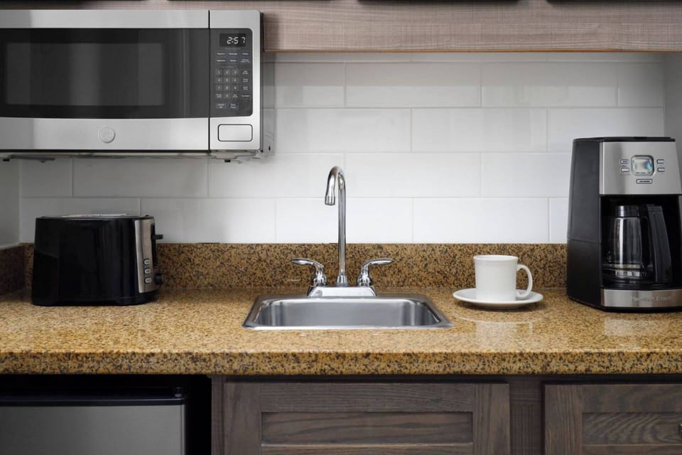 Kitchenette comes in guest bedroom with a king and a sleeper sofa.