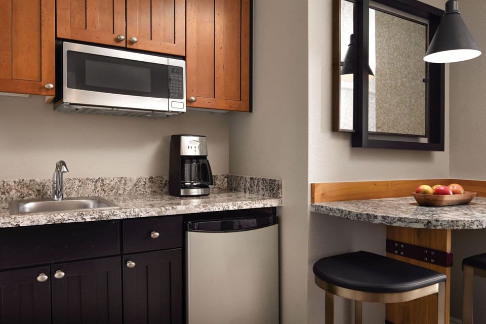 Guest room comes with a well appointed kitchenette and small dining table for 2.
