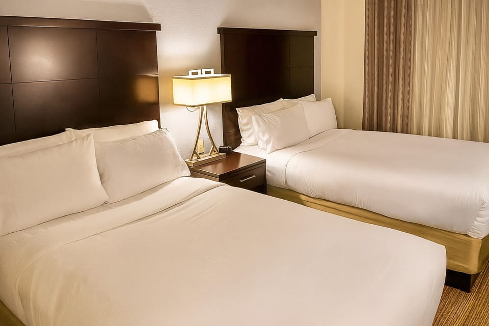 Unwind in crisp double queens after a busy day.
