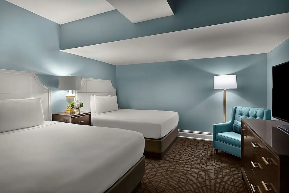 Settle in with two plush beds and a calming, modern palette.