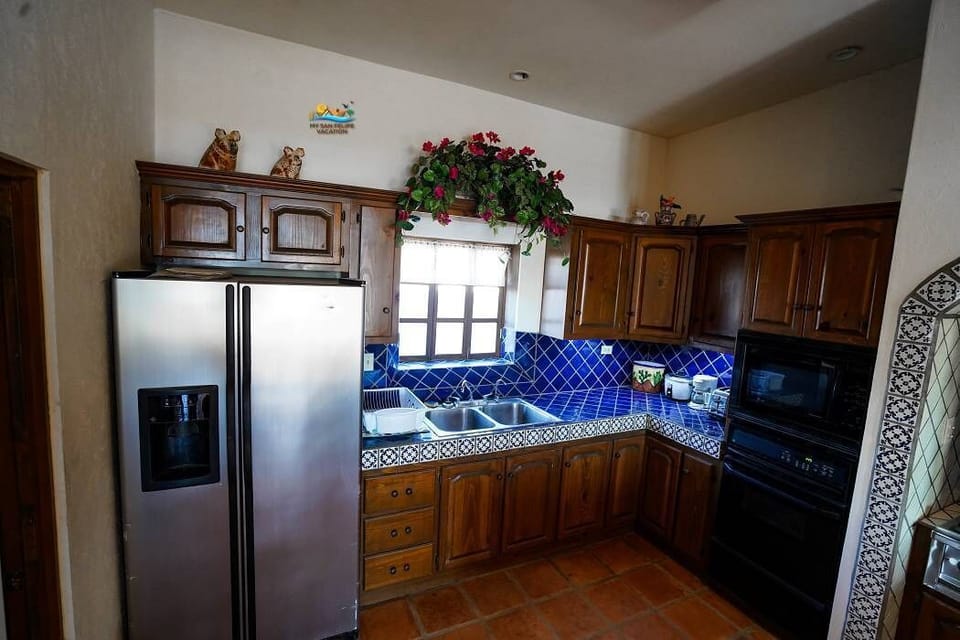 Full kitchen including a spacious fridge at this Chaparral vacation rental in El Dorado Ranch San Felipe Baja California Mexico — store all your groceries.