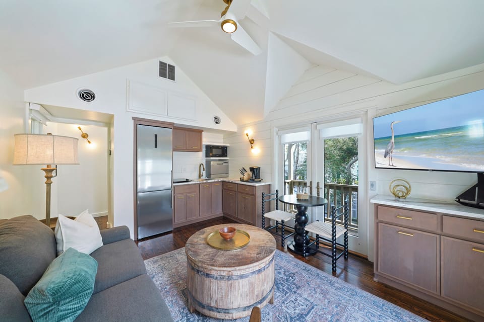 ALTERNATE VIEW OF SECOND FLOOR LIVING ROOM TO KITCHEN AREA