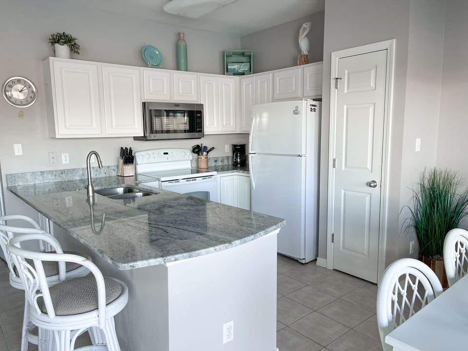 The fully equipped kitchen makes it easy to cook meals for the entire family!