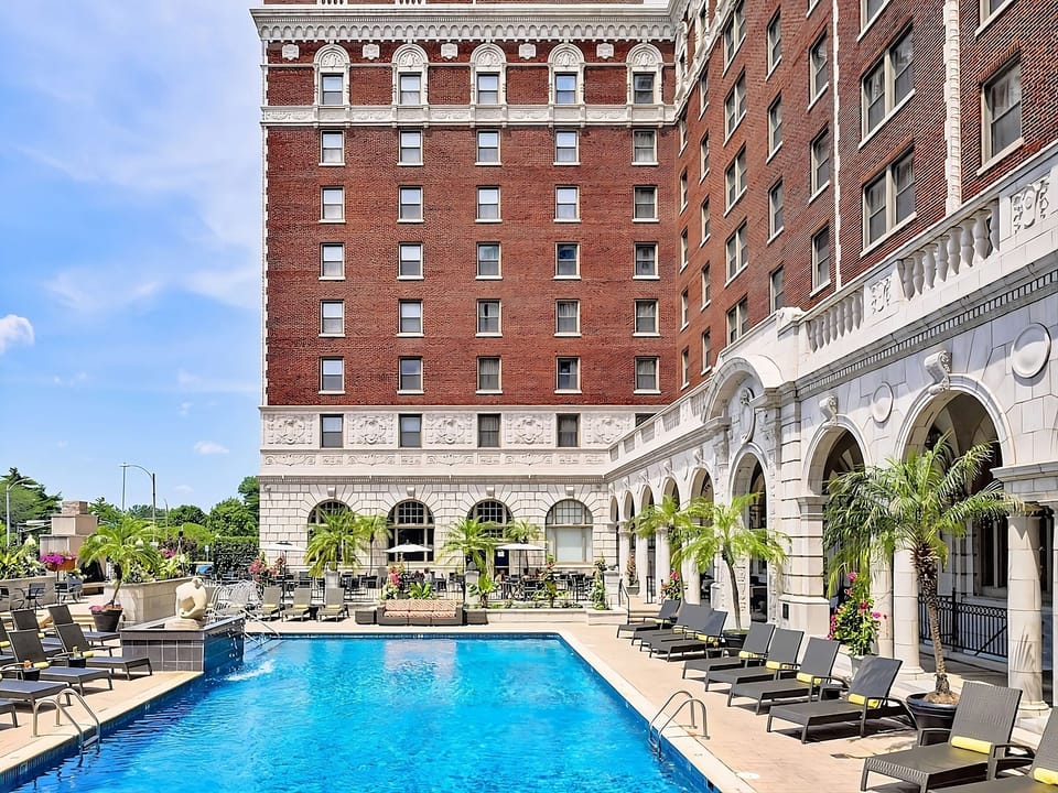 Soak up sunshine with poolside loungers in a classic courtyard.