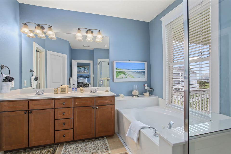 MASTER BATH HAS SOAKING TUB AND WALK IN SHOWER WITH DOUBLE VANITY